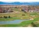 Aerial view of a community near a golf course with mountain views at 4340 Nelson Dr, Broomfield, CO 80023