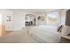 Main bedroom with sitting area, large window, and plush carpet at 4340 Nelson Dr, Broomfield, CO 80023