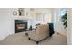 Cozy living room with fireplace, neutral decor, and natural light at 4340 Nelson Dr, Broomfield, CO 80023