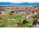 Aerial view showcasing a golf course community nestled in the foothills at 4340 Nelson Dr, Broomfield, CO 80023