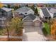 Two-story house with a three-car garage and a large driveway at 4340 Nelson Dr, Broomfield, CO 80023