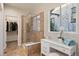 Spa-like bathroom with a large shower, tile flooring and vanity at 4763 Gould Cir, Castle Rock, CO 80109