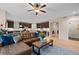 Open living room with a comfortable sectional sofa and wood floors at 4763 Gould Cir, Castle Rock, CO 80109