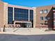 Building exterior showcasing the entrance and landscaping at 12565 Sheridan Blvd # 202, Broomfield, CO 80020