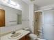 Bathroom with shower/tub combo, vanity, and linen storage at 12565 Sheridan Blvd # 202, Broomfield, CO 80020