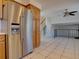 Kitchen with stainless steel fridge and oak cabinets at 7168 S Cody Way, Littleton, CO 80128