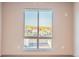 Bedroom window view of residential neighborhood and distant mountains at 12983 W Ida Ave # 302, Littleton, CO 80127