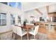 Bright dining room with hardwood floors and view into kitchen at 6 Yellow Flax, Littleton, CO 80127