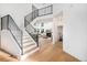 Elegant staircase with modern metal railings leading to the second floor at 6 Yellow Flax, Littleton, CO 80127