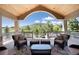 Relaxing deck with mountain views, wicker furniture, and covered seating area at 2916 Hiwall Ct, Castle Rock, CO 80109