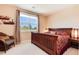 Upstairs bedroom with large bed and window at 2916 Hiwall Ct, Castle Rock, CO 80109