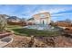 Large backyard with grassy area and rock landscaping at 20697 E Eastman Ave, Aurora, CO 80013