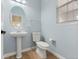 Small bathroom with pedestal sink and toilet at 20697 E Eastman Ave, Aurora, CO 80013