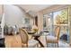 Dining area with glass table and view into living room at 2901 W Long Dr # G, Littleton, CO 80120