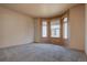 Well-lit bedroom with bay window and mirrored closet doors at 9784 W Euclid Dr, Littleton, CO 80123