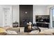 Spacious living room featuring a modern fireplace and comfortable seating at 3010 Newfound Lake Rd, Berthoud, CO 80513