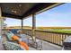 Relaxing covered patio overlooking a scenic golf course at 3010 Newfound Lake Rd, Berthoud, CO 80513