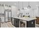 Modern kitchen island with white cabinetry and stainless steel appliances at 3010 Newfound Lake Rd, Berthoud, CO 80513