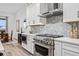 Modern kitchen with stainless steel appliances and white shaker cabinets at 3010 Newfound Lake Rd, Berthoud, CO 80513