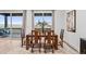 Bright dining room with large windows and wooden table at 3010 Newfound Lake Rd, Berthoud, CO 80513