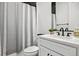 Clean bathroom with shower/tub combo and white vanity at 3010 Newfound Lake Rd, Berthoud, CO 80513