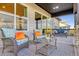Relaxing covered patio with wicker furniture and view of the landscape at 3010 Newfound Lake Rd, Berthoud, CO 80513
