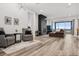 Modern living room with fireplace, large windows and access to patio at 3010 Newfound Lake Rd, Berthoud, CO 80513
