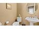 Updated powder room with pedestal sink and elegant fixtures at 4640 Belford Cir, Broomfield, CO 80023