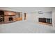 Finished basement with a fireplace, wet bar, and built-in shelving at 8102 Windwood Way, Parker, CO 80134