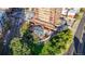 Aerial view of building, pool, and green space at 100 Park W Ave # 608, Denver, CO 80205