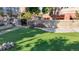Artificial turf lawn area with rock border at 100 Park W Ave # 608, Denver, CO 80205