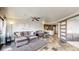 Open concept living area with tile floors and a cozy seating arrangement at 100 Park W Ave # 608, Denver, CO 80205