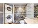 Updated bathroom with stackable washer and dryer at 100 Park W Ave # 608, Denver, CO 80205