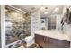 Modern bathroom with a walk-in shower and updated vanity at 100 Park W Ave # 608, Denver, CO 80205