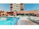 Inviting community pool with surrounding patio furniture at 100 Park W Ave # 608, Denver, CO 80205