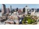 Aerial view of a downtown condo building with city skyline in the background at 100 Park W Ave # 608, Denver, CO 80205