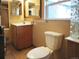 Bathroom with tiled floor, toilet, and vanity at 230 Emery St, Longmont, CO 80501