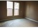 Bright bedroom with hardwood floors and two windows at 230 Emery St, Longmont, CO 80501