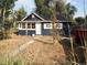 Charming blue house with a small front yard and walkway at 230 Emery St, Longmont, CO 80501