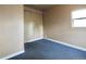 Small bedroom with blue carpet and a window at 230 Emery St, Longmont, CO 80501