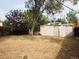 Large backyard with a shed and mature trees at 230 Emery St, Longmont, CO 80501