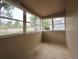 Bright sunroom with multiple windows and light-colored flooring at 230 Emery St, Longmont, CO 80501