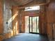 Unfinished room with large window and sliding glass door at 230 Emery St, Longmont, CO 80501