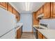 Full kitchen with wood cabinets and appliances at 12191 Melody Dr # 102, Westminster, CO 80234