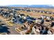 Aerial view of house and neighborhood with solar panels at 844 Dakota Ln, Erie, CO 80516