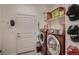 Convenient laundry room with washer, dryer, and storage at 11560 Kalispell St, Commerce City, CO 80022