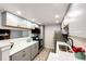 Modern kitchen with gray cabinets, white countertops, and stainless steel appliances at 18196 E Ohio Ave # 104, Aurora, CO 80017