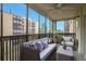 Relaxing screened balcony with seating area and view at 3465 S Poplar St # 308, Denver, CO 80224