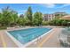 Outdoor swimming pool with comfortable lounge chairs at 3465 S Poplar St # 308, Denver, CO 80224