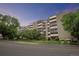 Brick apartment building with ample parking and landscaping at 3465 S Poplar St # 308, Denver, CO 80224